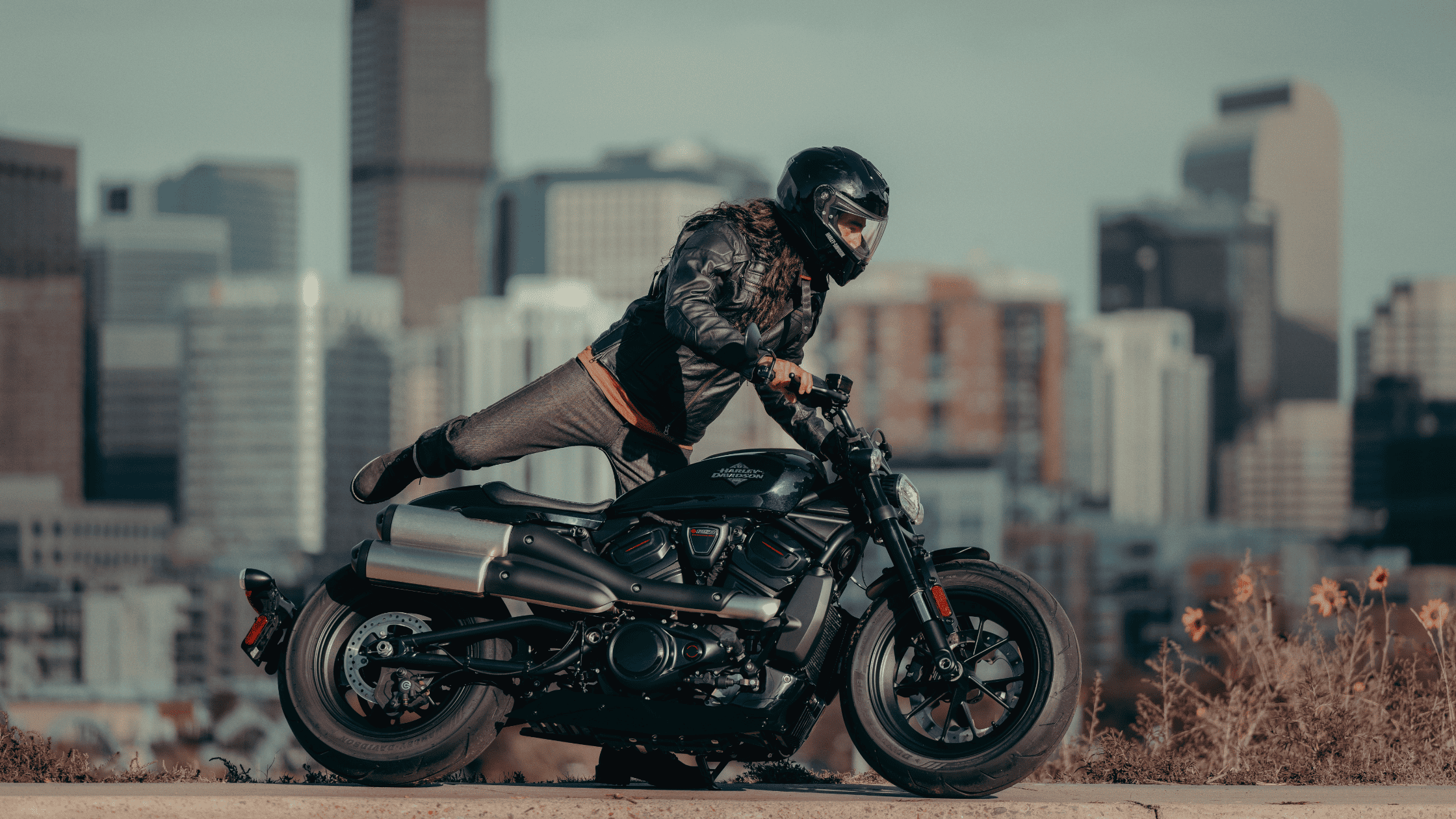 2025 Harley-Davidson Sportster S black motorcycle with stunt rider in Anderson, South Carolina