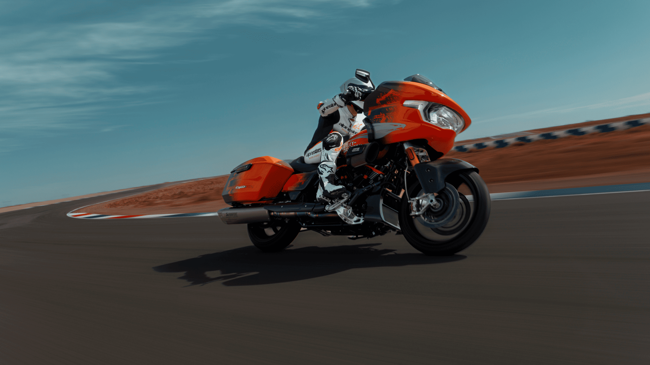 2025 Harley-Davidson® CVO™ Road Glide® RR takes a turn at high speed on closed racetrack