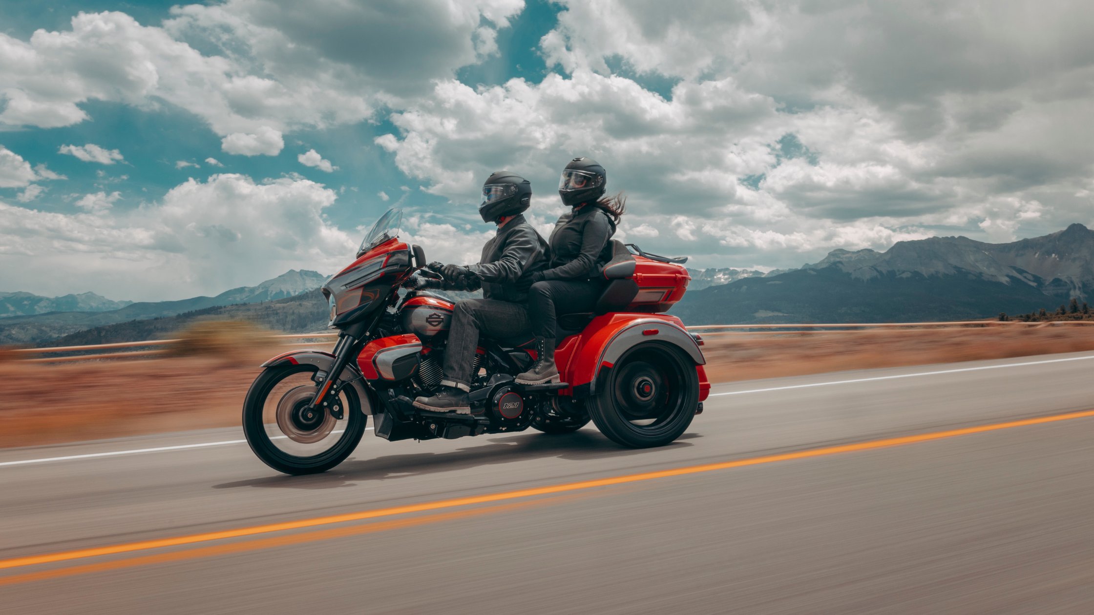 2026 H-D® CVO™ Street Glide® 3 Limited ridden by two riders on a mountain highway under cloudy skies