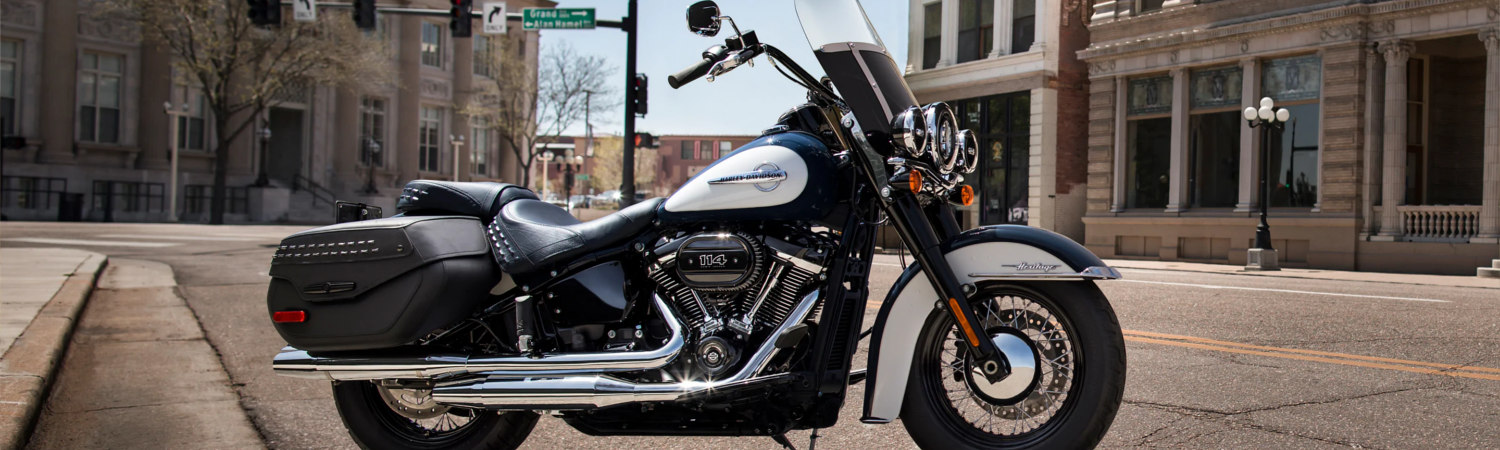Black 2021 Harley-Davidson® Softail® Heritage Classic parked on a city street